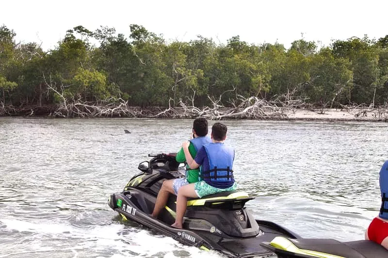 Guided jet skis crossing the Ten Thousand Islands near a Marco Island sunset cruise route, Florida